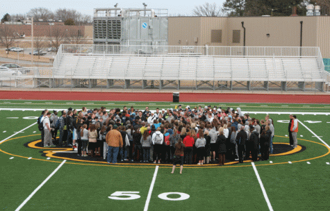 Students, faculty and staff gathered on the football field to pay tribute to student Eddie Key who died Saturday, February 8. 