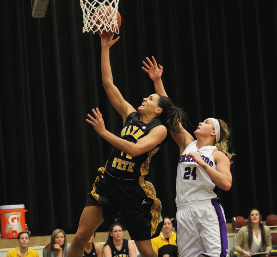 Jordan Spencer drives the lane and gets an easy two points for the Wildcats against Winona State. Jordan was a rebound short of a double-double with 12 points and nine boards.