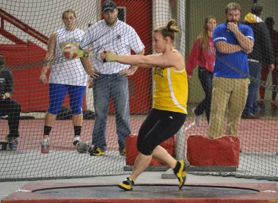 Emily Wells takes aim at the weight throw in last weekend’s South Dakota Twilight meet in Vermillion, S.D. Wells took first place in the event with a throw of 59 feet.