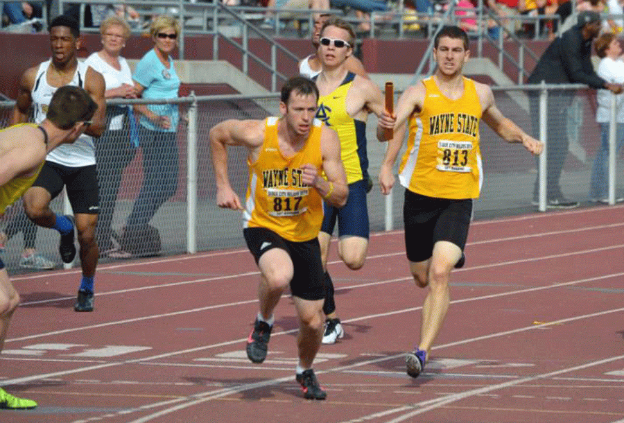 Jared Balady hands off the baton to Mickey Doerr at last weekend’s Sioux City Relays.