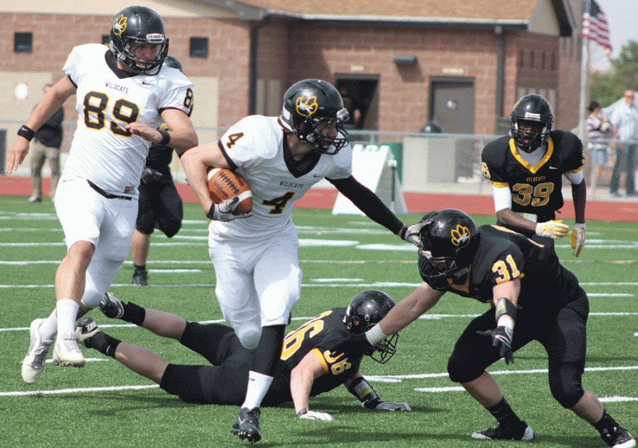 Adam Stark gives a stiff arm to a teammate in Wayne State’s spring game. Adam Stark set a record last season with a 97-yard touchdown reception.