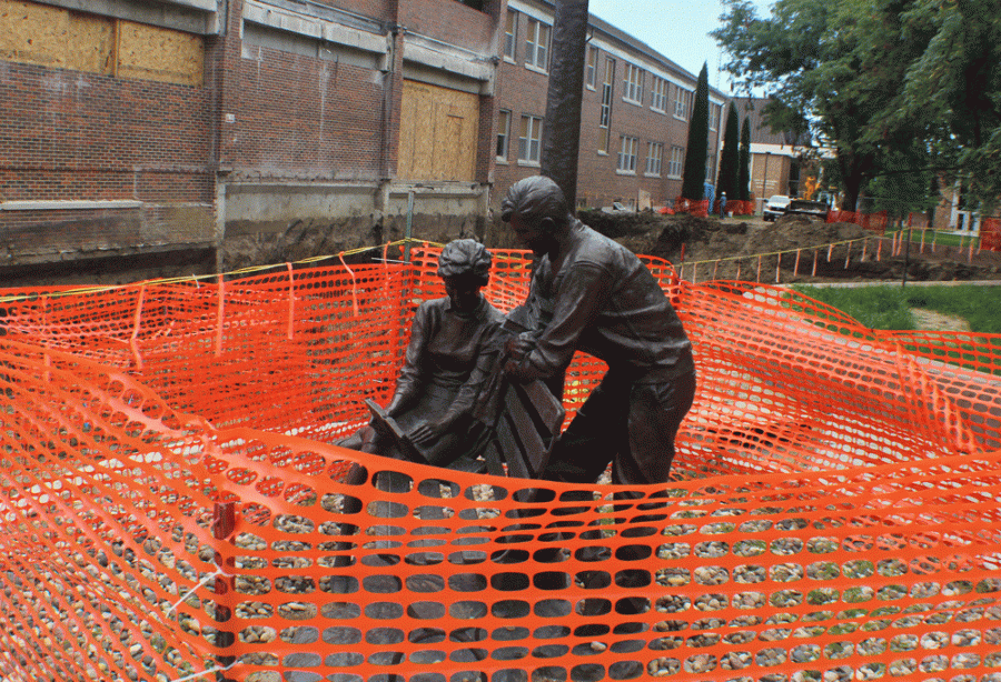 Fencing now surrounds the statues in front of the library, which is now in Phase 1 of construction and remodeling.