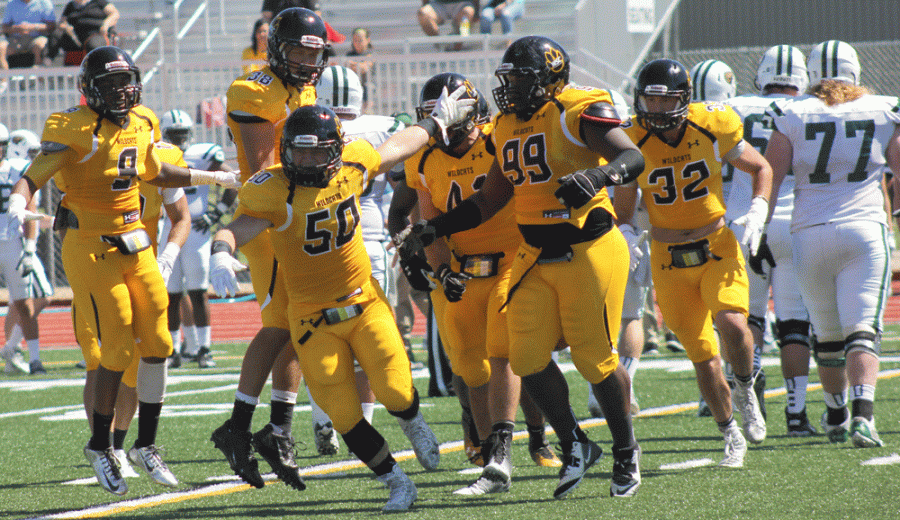 Tyson McGill (50) celebrates with his teammates after a defensive turnover in a game earlier this season.

