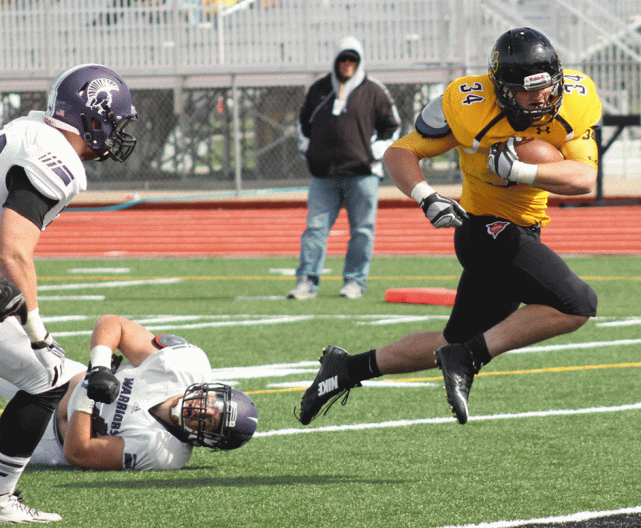 Ryan Ludlow rumbles in for a touchdown in a game earlier in the year. Ludlow scored the game-winning touchdown in overtime against Southwest Minnesota State.