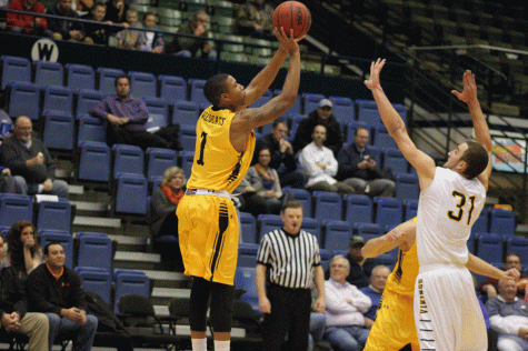 Kendall Jacks sinks a three-pointer in the Wildcats' loss to the Vikings