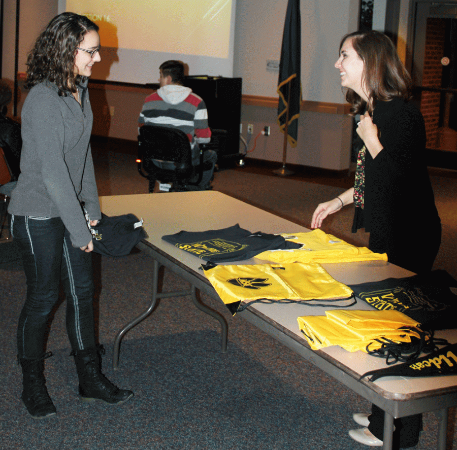 WSC student Amanda Murphy won a free tshirt from transfer admissions representative Erin Polacek at the Susan Thompson Buffett Scholarship Luncheon on Jan. 26 in Frey Conference Suite.