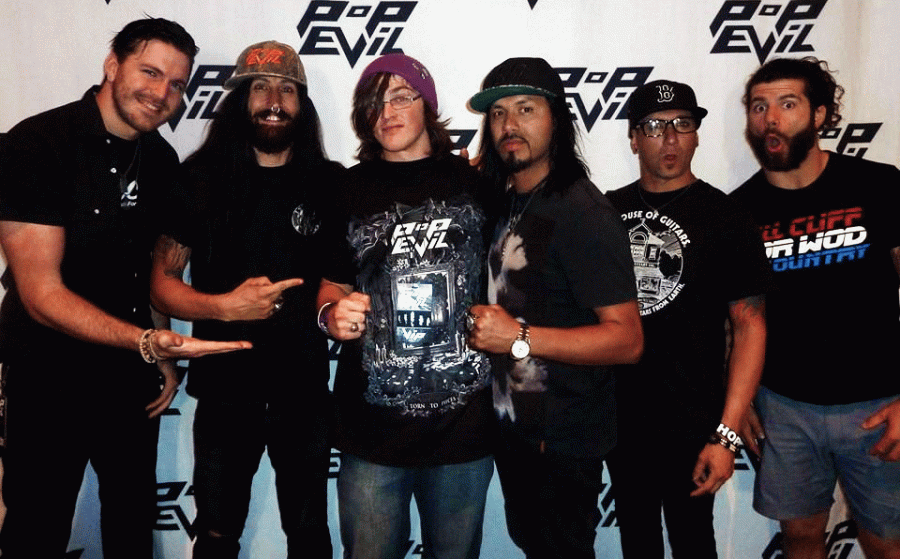 Dusty Leifert (middle) stands with Nick Fuelling, Matt DiRito, Leigh Kakaty, Chachi Riot and Dave Grags of alternative rock band Pop Evil.
