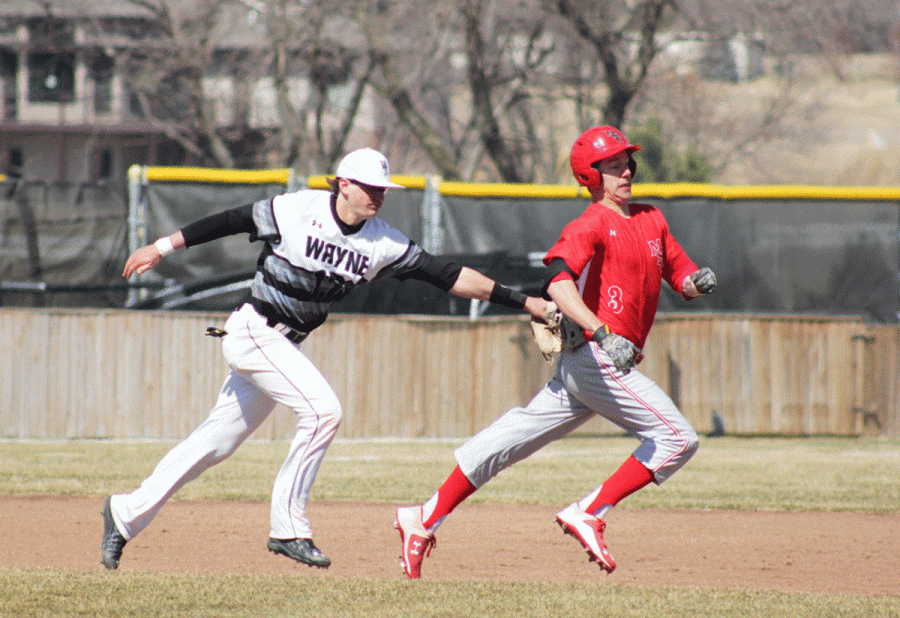 Tanner Simons chases down a Minot State baserunner caught in a pickle during last Saturday’s doubleheader with the Beavers.