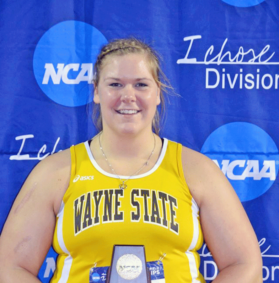 Sara Wells with her trophy after winning the NCAA Division II Indoor National Championship in the shotput.
