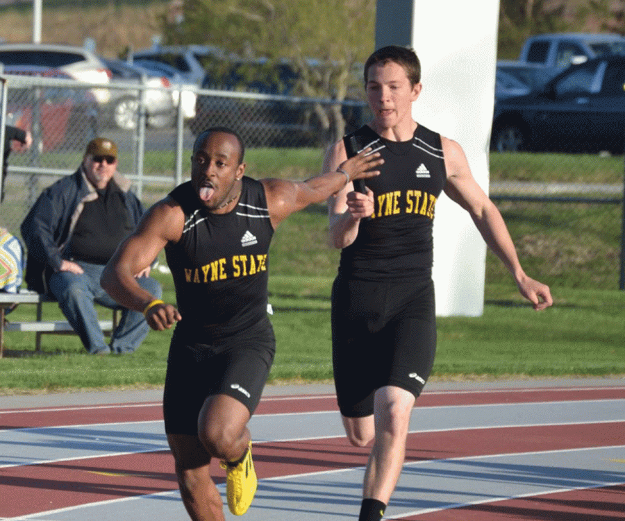 Braxton Adams takes the handoff from Kole Heller in the 4 x 400 relay, finishing second in the event.