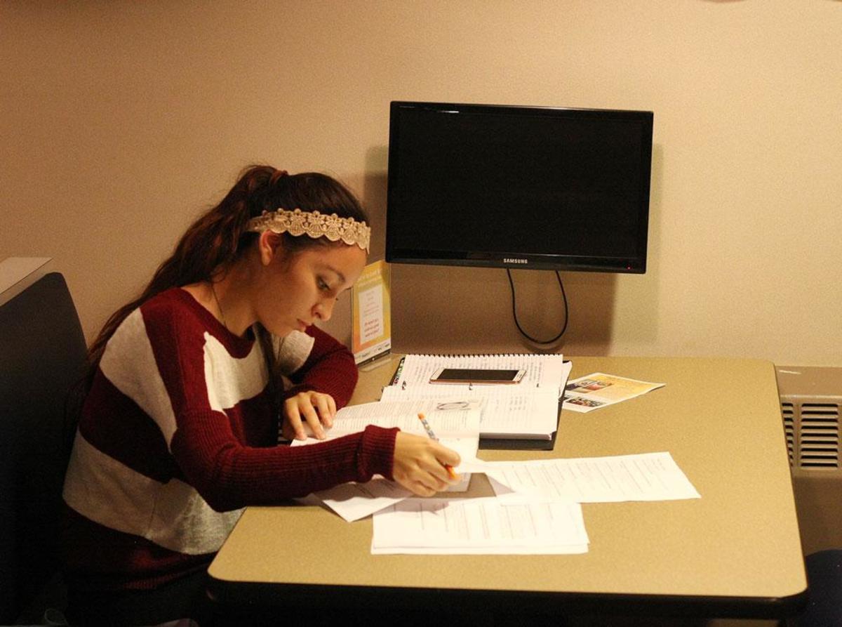 Freshman Odalys Almaraz a Susan Thompson Buffett recipient is studying in the Upper Deck along side other scholarship recipients.