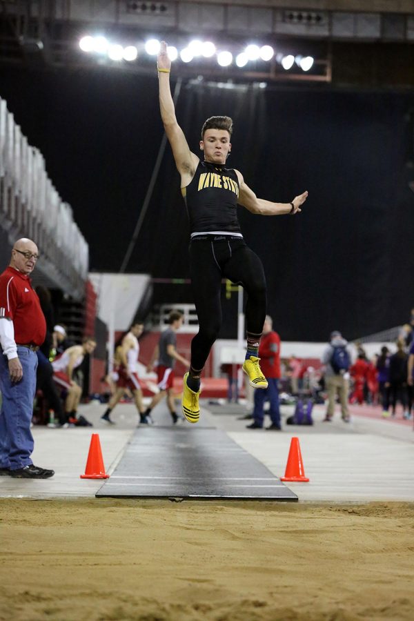 Brady Metz competes in the long jump this past weekend, eventually placing fifth. Metz won the tripple jump later in the evening