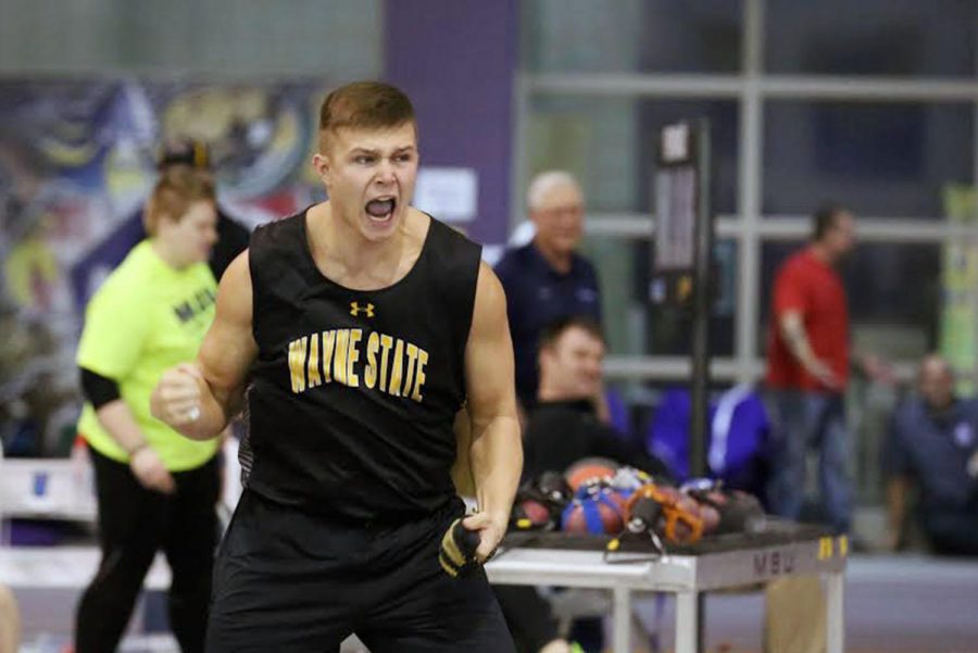 Bryan Dunn celebrates after winning the NSIC weight throw competition.