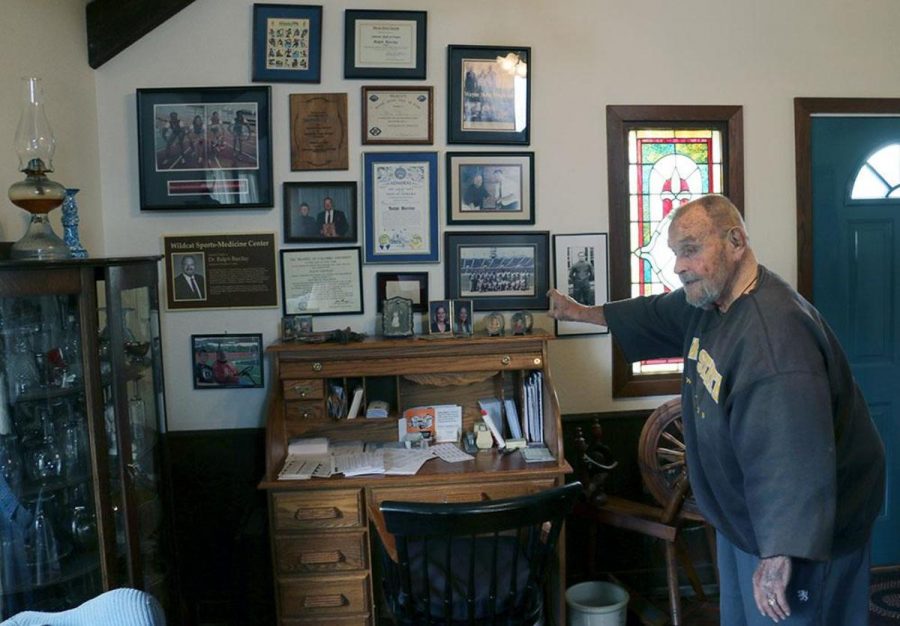 Barclay points to several photos on his wall that hold some of his greatest accomplishments, like the baton from the 1996 women’s Olympic relay team that he worked with.