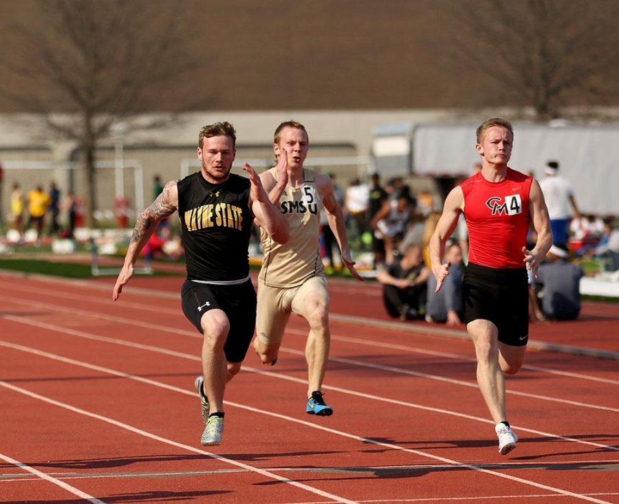 Clay Kramper reaches a new personal best in the 100 meter dash on Saturday in Emporia.