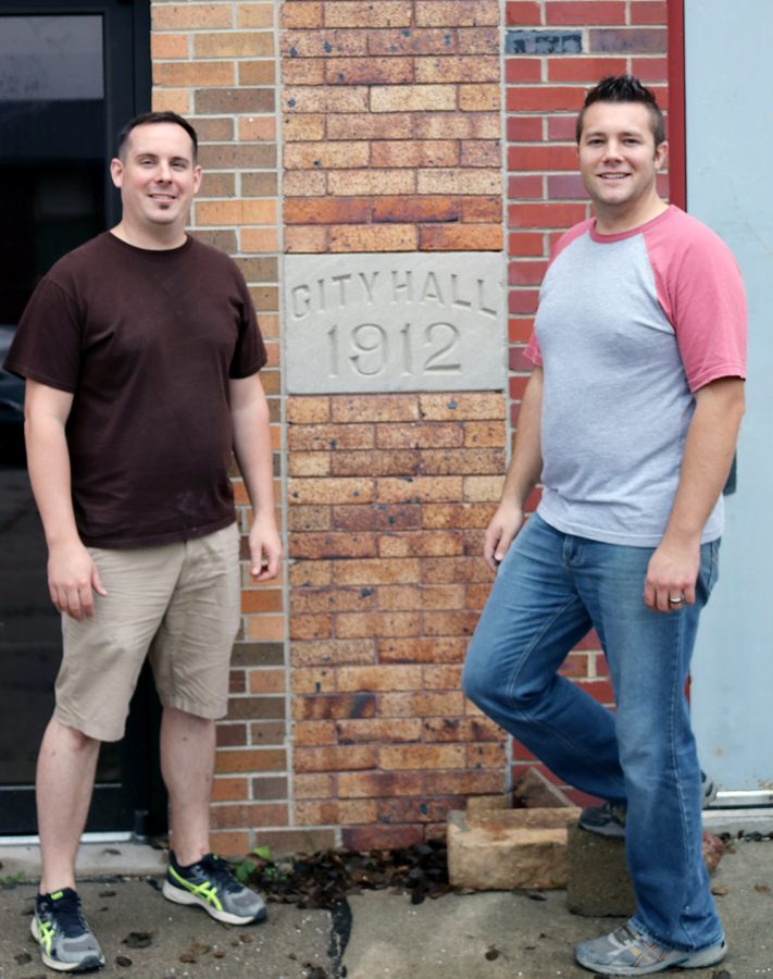 Owners+Mark+Kanitz+and+Lukas+Rix+stand+in+front+of+the+old+1912+Building.+A+part+of+the+building+is+being+leased+out+to+Bryce+Allen+to+start+up+a+brewery+for+craft+beer.