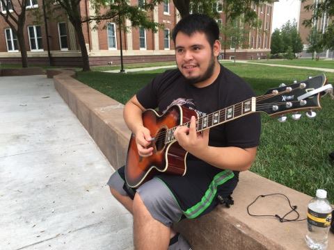 Senior Henry Ventura likes to play his guitar outside of Conn Library to build confidence playing in public and in hopes of finding people with the same interests in music.