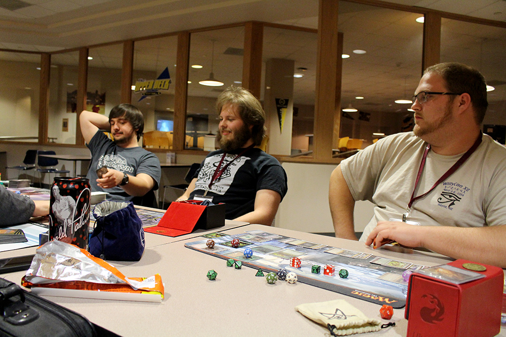 Alumni join students at WillyCon to play Magic the Gathering. Left to right: Patrick Hancock, Michael Vacha and Gabriel Flanagan.
