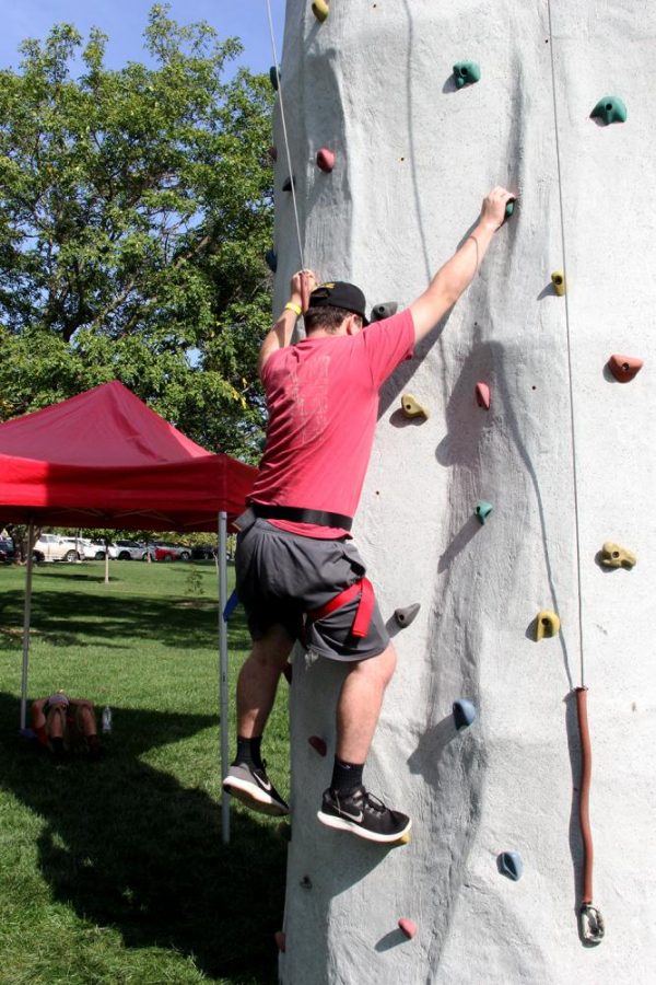 Matt Rodansky climbs the rock wall.