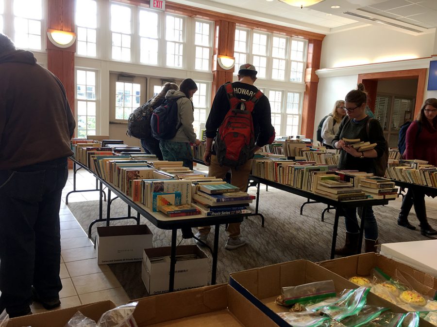 Students helped Pi Gamma Mu with the sale of books and baked goods. The book and bake sale took place in the lobby of Connell Hall.