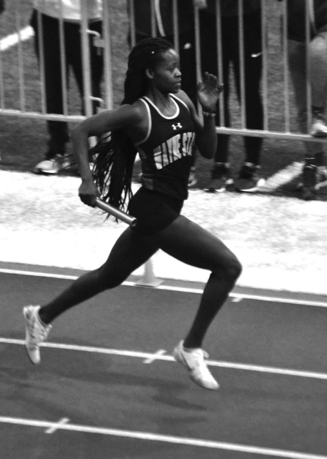 Senior Joan Jelimo, distance runner, runs her leg of the 4x400-relay Friday afternoon. The team took home a fourth place finish with a time of 4:06.60.