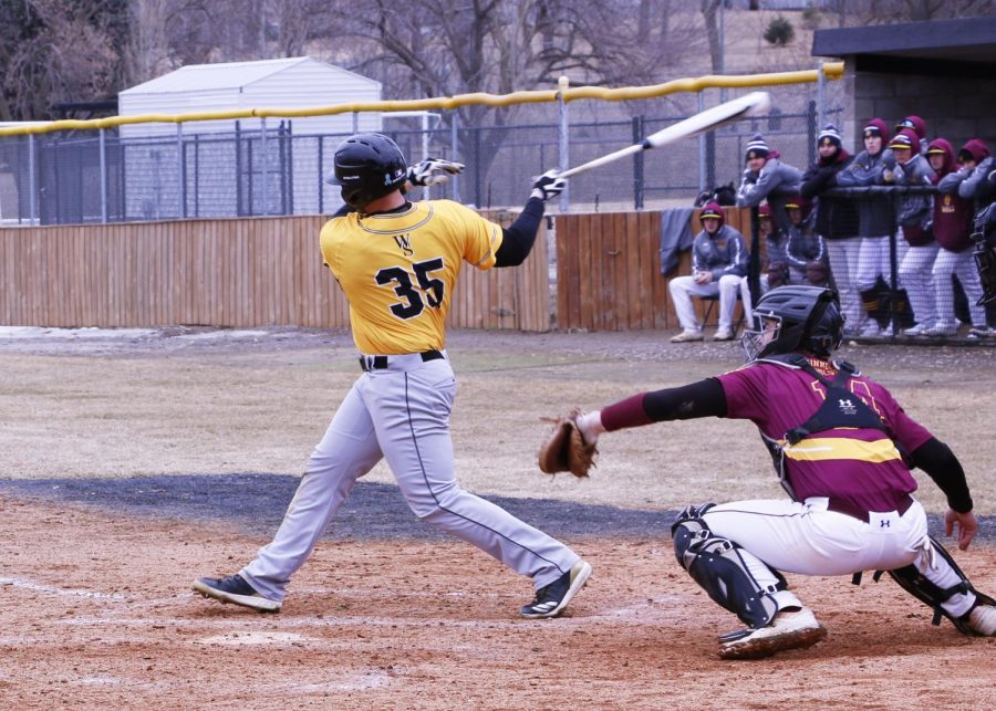 Junior Bryce Bisenius makes contact with a pitch against the Minnesota Duluth Bulldogs on Saturday.