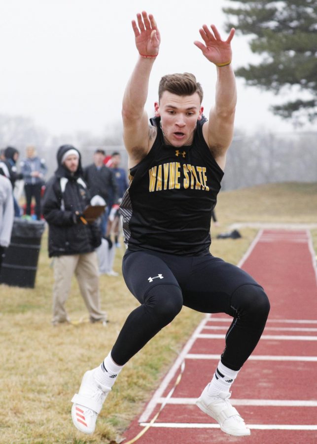 Brady Metz participating in the long jump during his time at WSC.