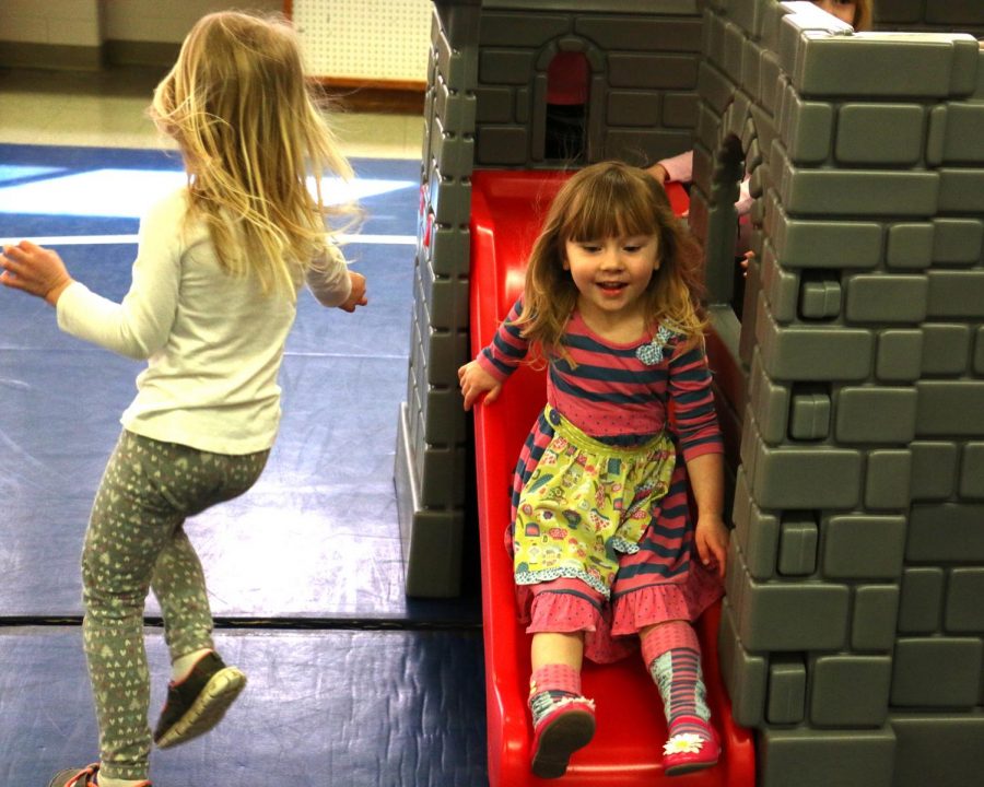Two children enrolled in WSC’s Kiddie College preschool enjoy the new early childhood indoor activity area which opened on March 26 as part of the Nature Explore program. 
