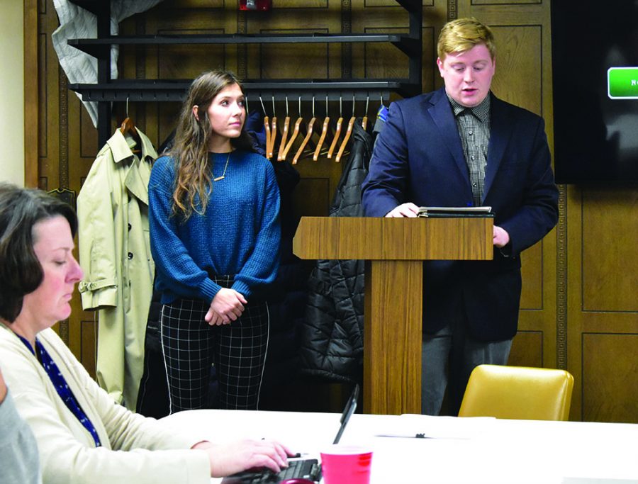 Senior Adam Smith, with the support of junior Kori Siebert, presents on behalf of the Civic Leadership at Wayne State (CLAWS) club to the city council.