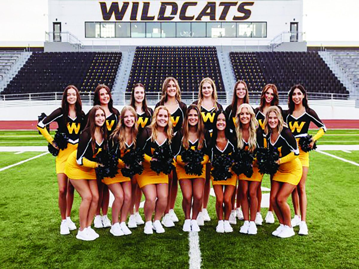 Members of the Aristocats Dance Team pose on the WSC football field for a photo. Photo courtesy of Farmer's Wife Photography.