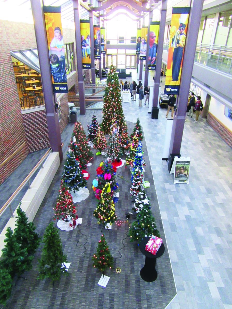 Decorated trees are displayed in the atrium of the Canter Student Center during Pi Gamma Mu's Festival of Trees event. Photo courtesy of Connor Semin.