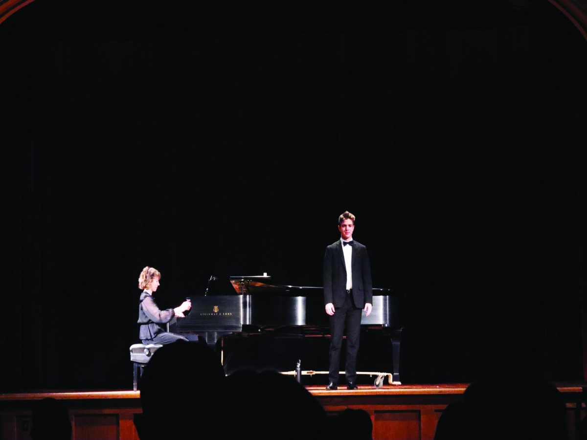 WSC senior Christopher Woerdemann, right, sings one of the pieces for his recital while being accompanied by WSC staff accompanist Shelly Armstrong (left). Photo by Cassie Schlautman.