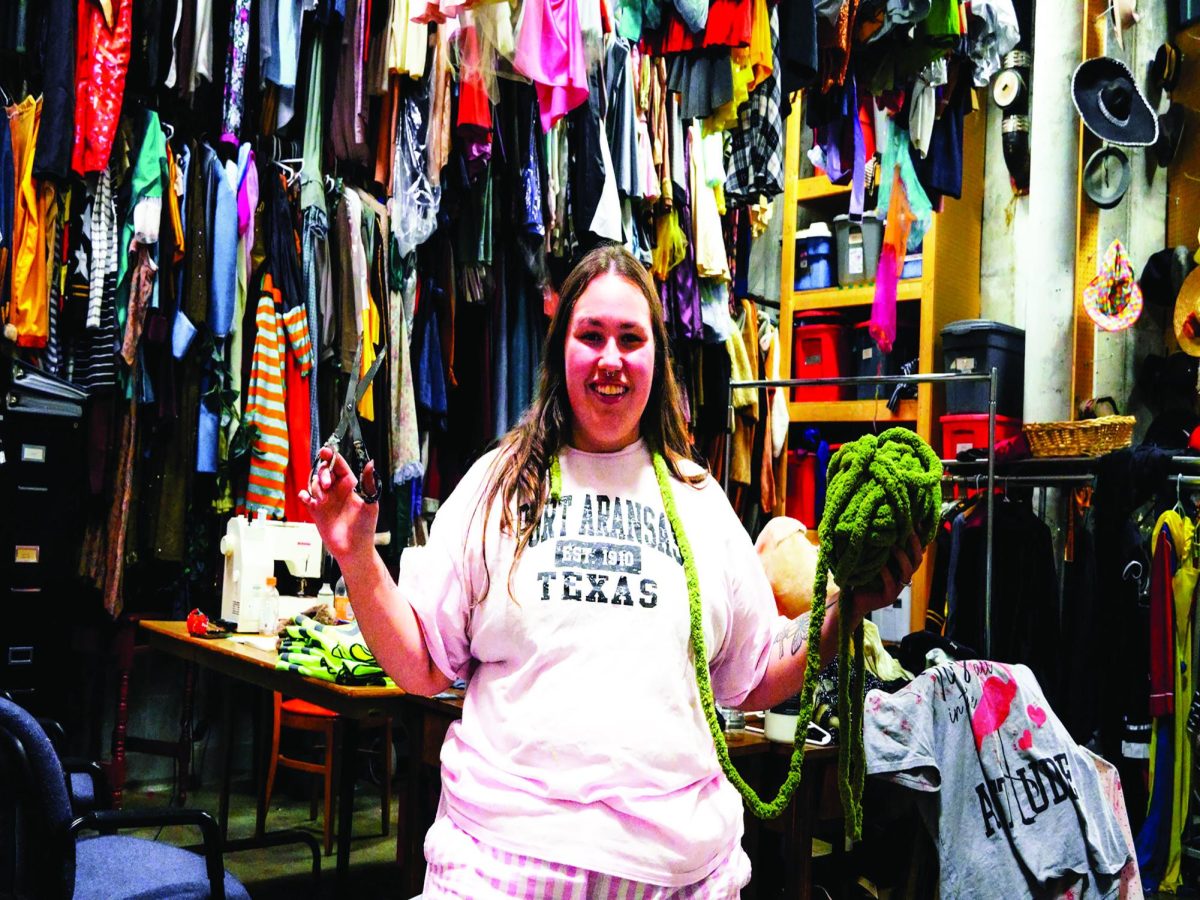 WSC junior Mariah Pleskac poses in the theatre department's costume closet. Photo by Taylor Morse.