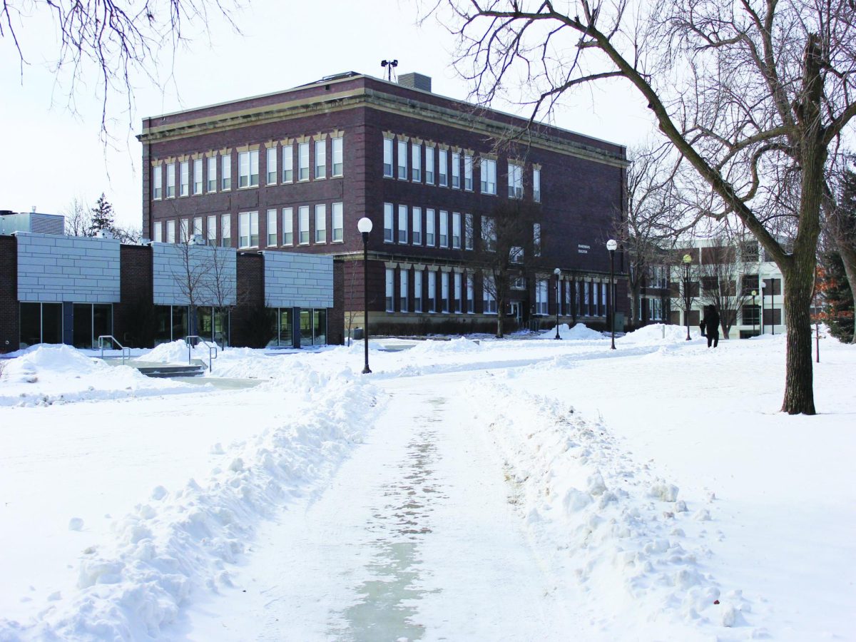 Snow surrounds the Brandenburg academic building on campus.