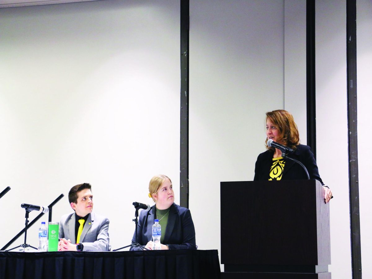 WSC staff member Dr. Laura Deninger, right, asks a question while WSC Student Senate presidential candidate Braxton Dalton, left, and his running mate, Ava Hoffschneider, middle, listen.