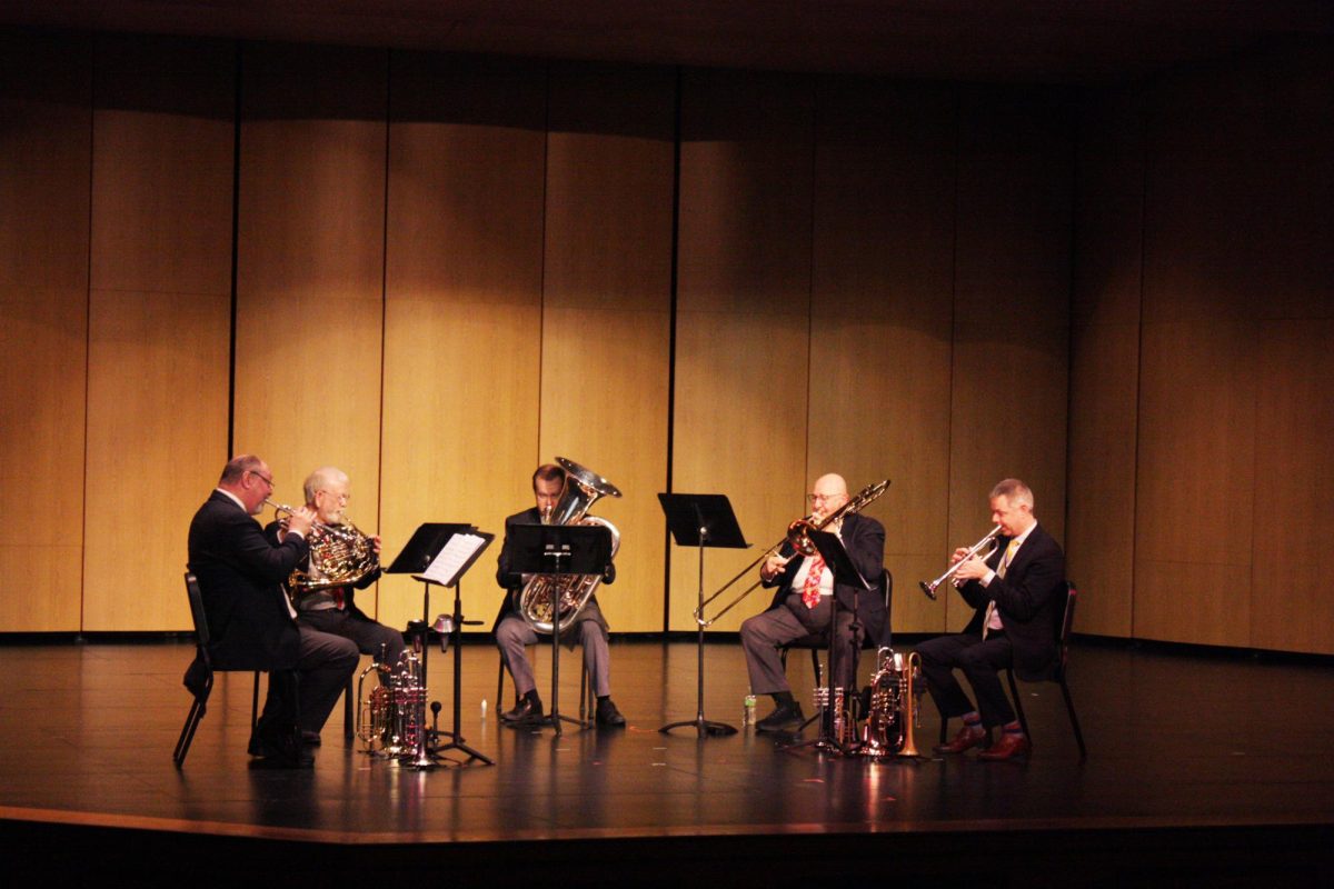 Touch of Brass members (l-r) Kevin McLouth, Gary Reeves, Josh Calkin, Randy Neuharth, and Dave Bohnert stand on the stage prior to their first piece.