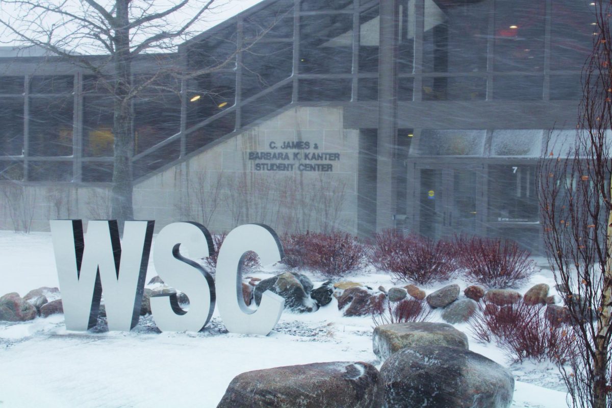Snow falls in front of Kanter Student Center on the WSC campus.
