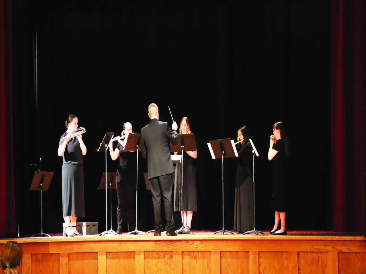 WSC flute choir members perform one of their pieces while directed by WSC woodwind instructor Karl Kolbeck. 