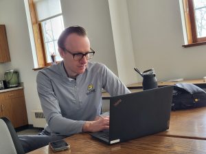 Mass comm and broadcast professor at WSC, Pat Janssen, working on class materials.